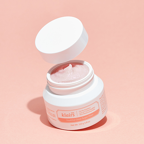 Tipped open jar of the klairs youthful glow sugar mask with the lid hovering above it: the second step to prep your skin for flawless make up