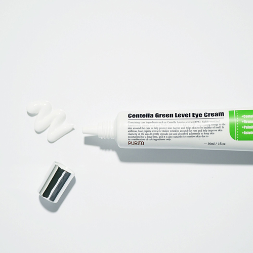 opened Tube of the purito centella green level eye cream with the product squeexed out in a zig zag next to the mouth and the cap below it: the fourth step to prep your skin for flawless make up